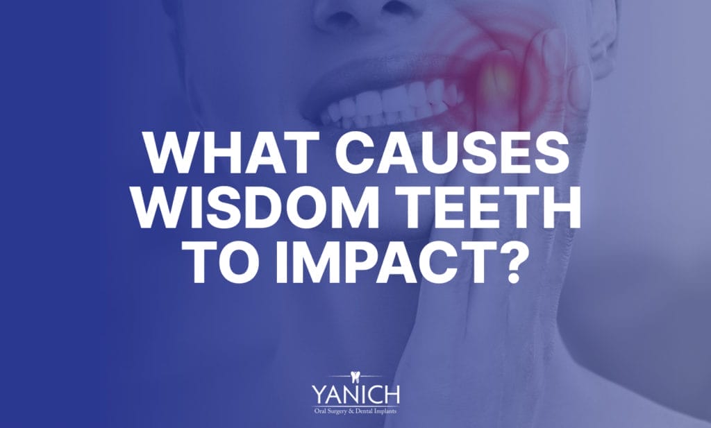 What causes wisdom teeth to impact?